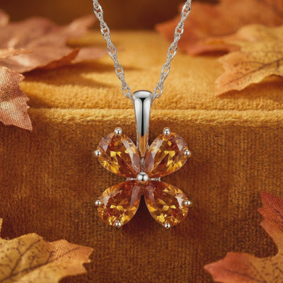Floral simulated topaz necklace in solid white gold.