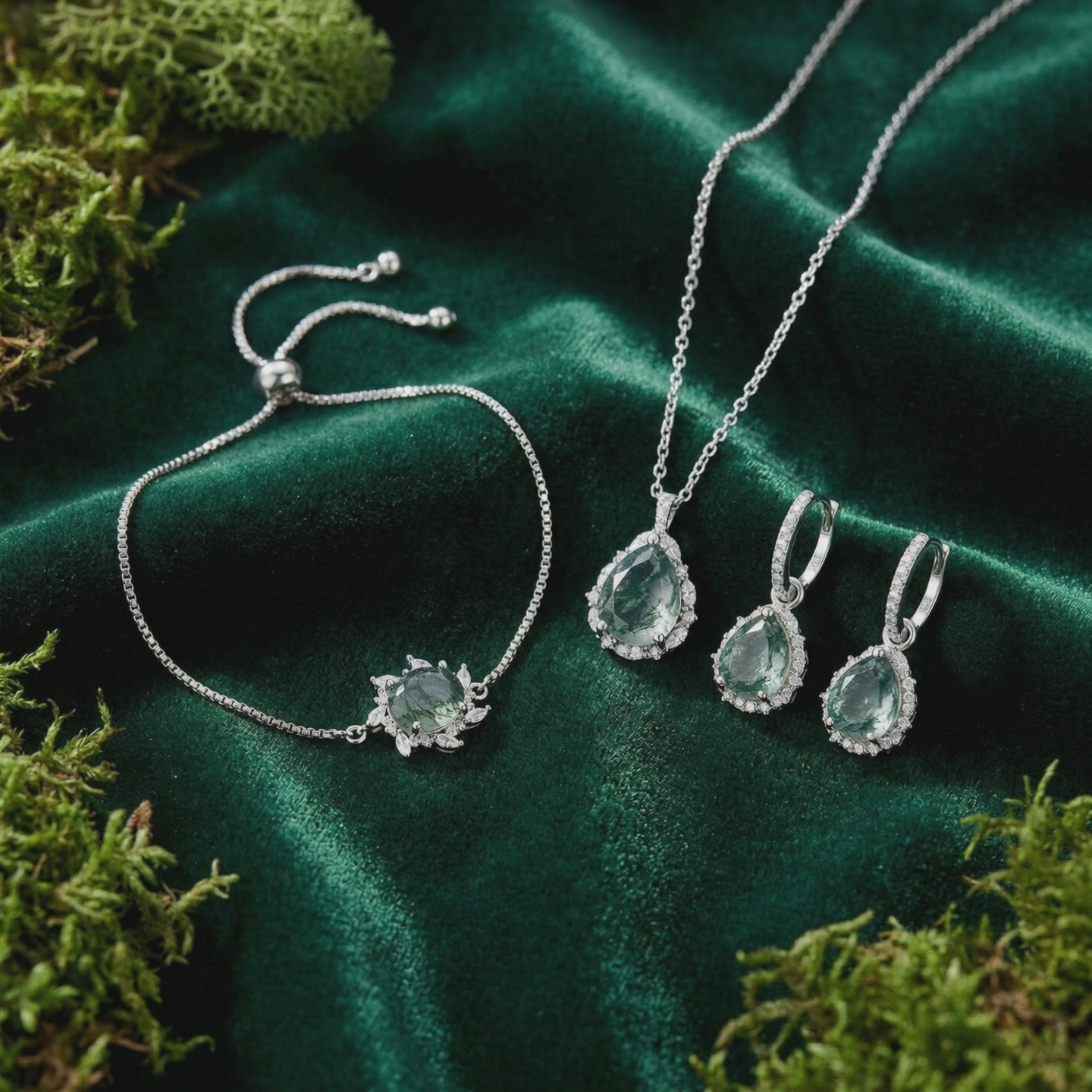 Moss Agate jewelry set in solid gold, including necklace, earrings, and bracelet.