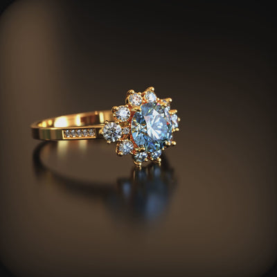 The Bethany 1.5 carat blue moissanite halo ring in solid gold.