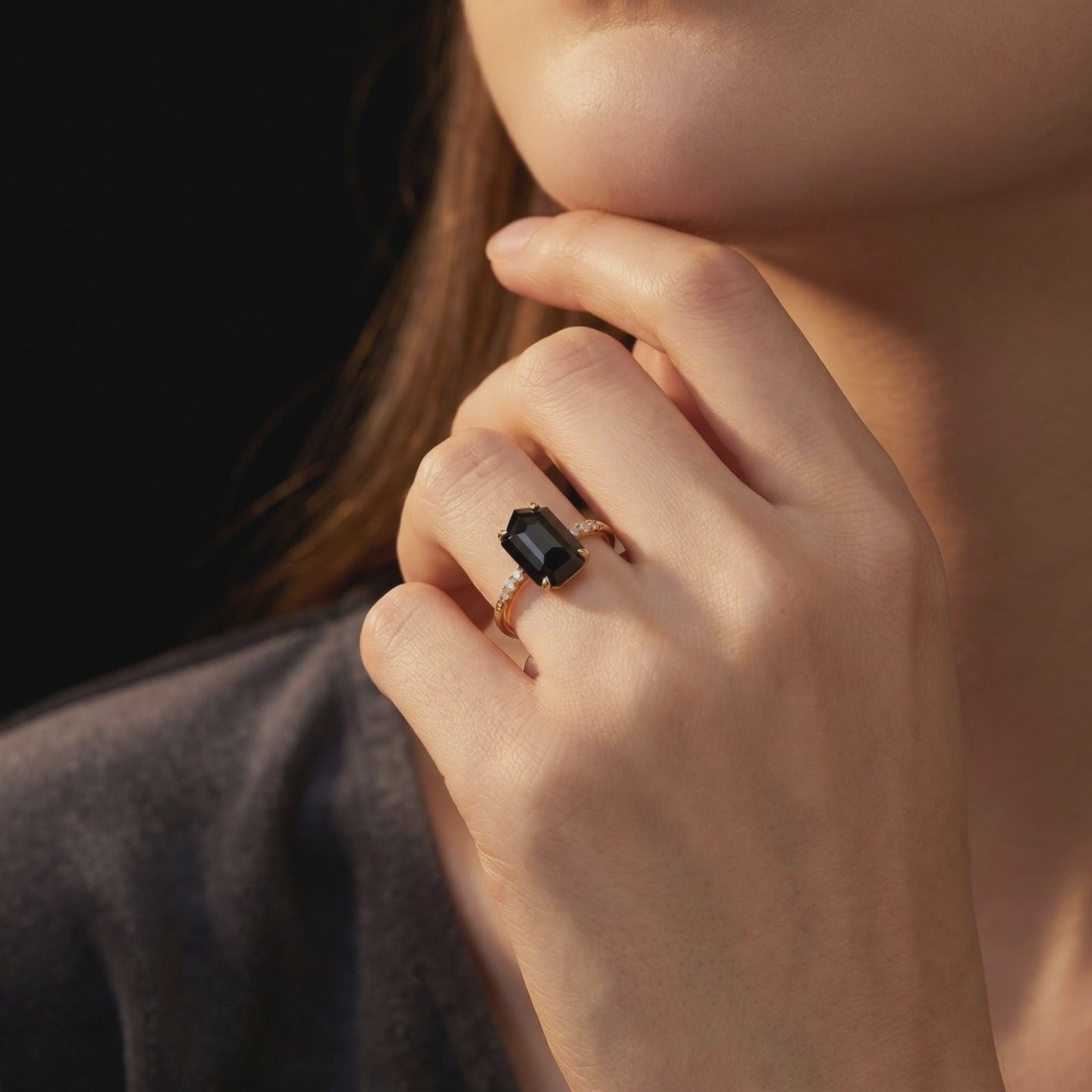The Noctura solid gold ring featuring an irregular-cut natural black onyx.