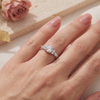 The Carlotta solid gold ring with simulated diamonds worn on a finger.