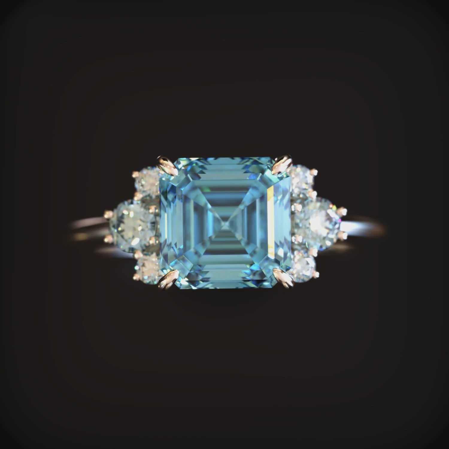 A solid gold ring with a blue moissanite.