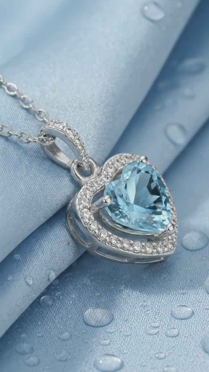 Simulated aquamarine heart pendant necklace in solid gold.