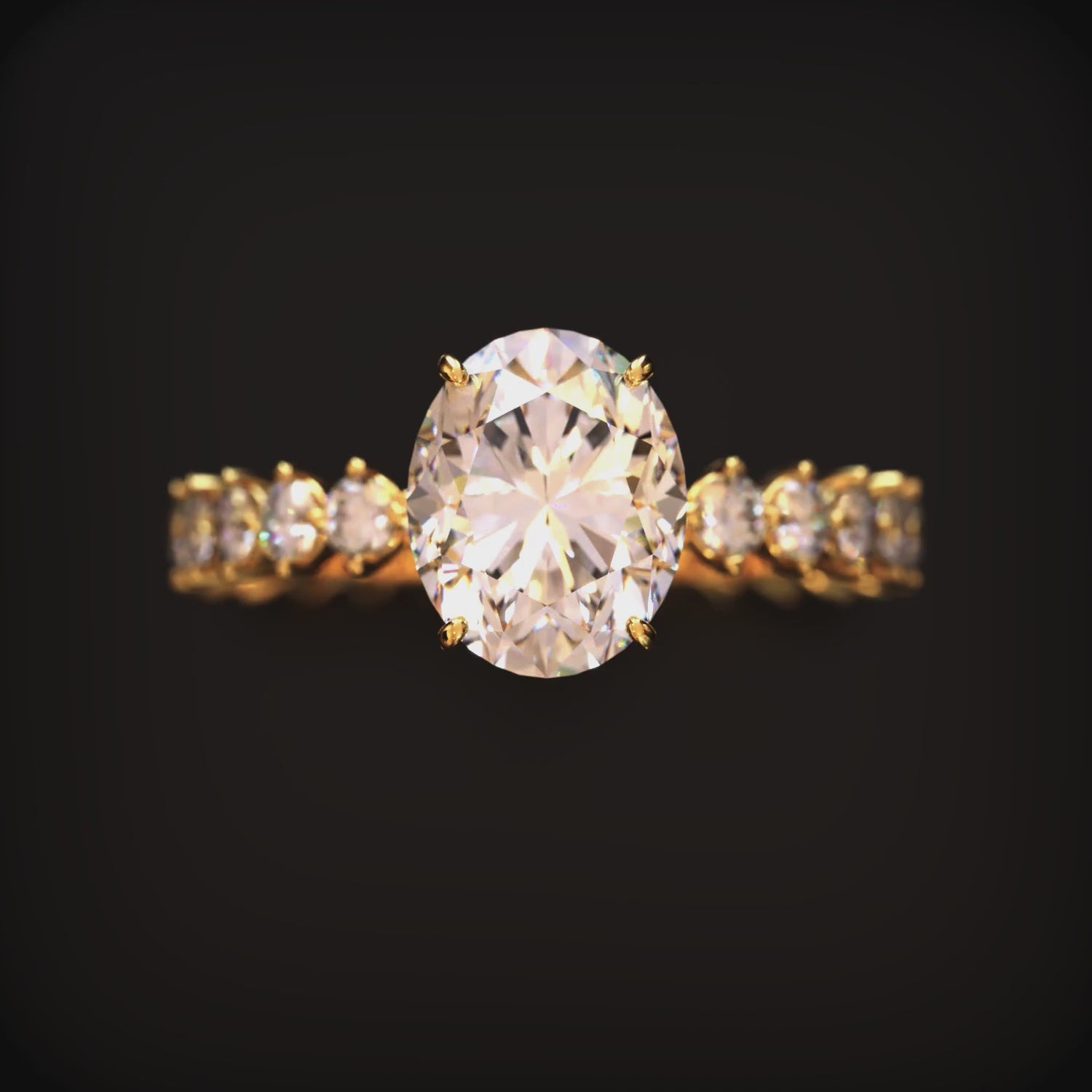 A solid gold ring with an oval moissanite center stone and eternity band.
