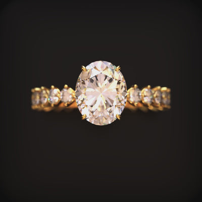 A solid gold ring with an oval moissanite center stone and eternity band.