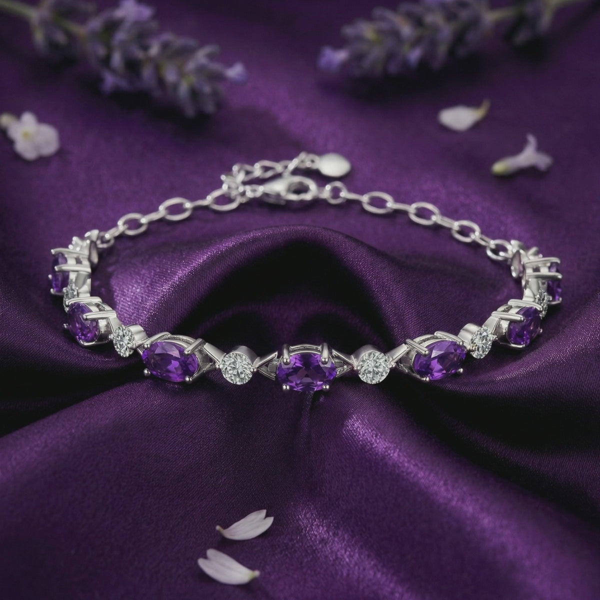 A solid gold bracelet with natural amethyst and simulated diamond accents.