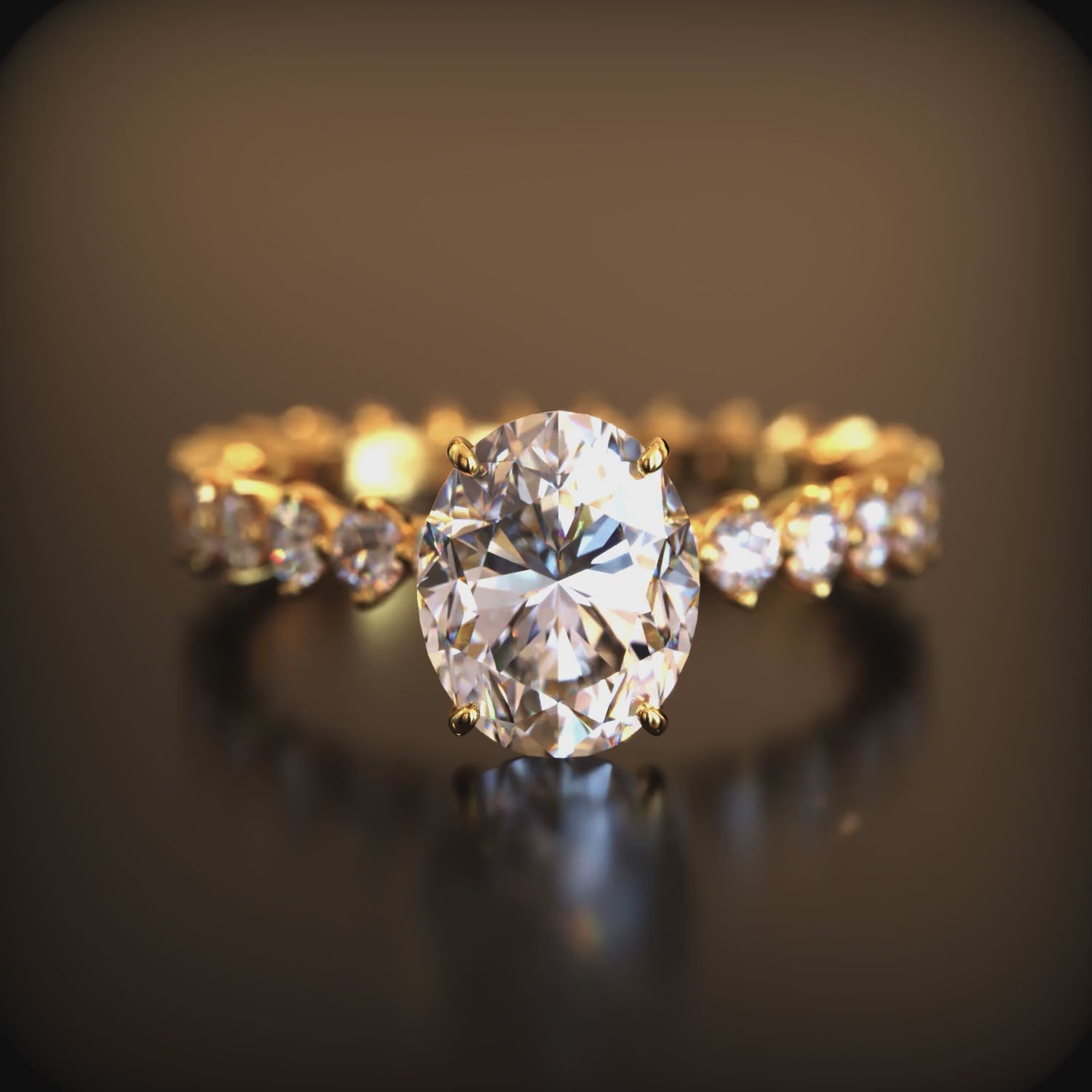 A solid gold moissanite ring with an oval center stone and eternity band.