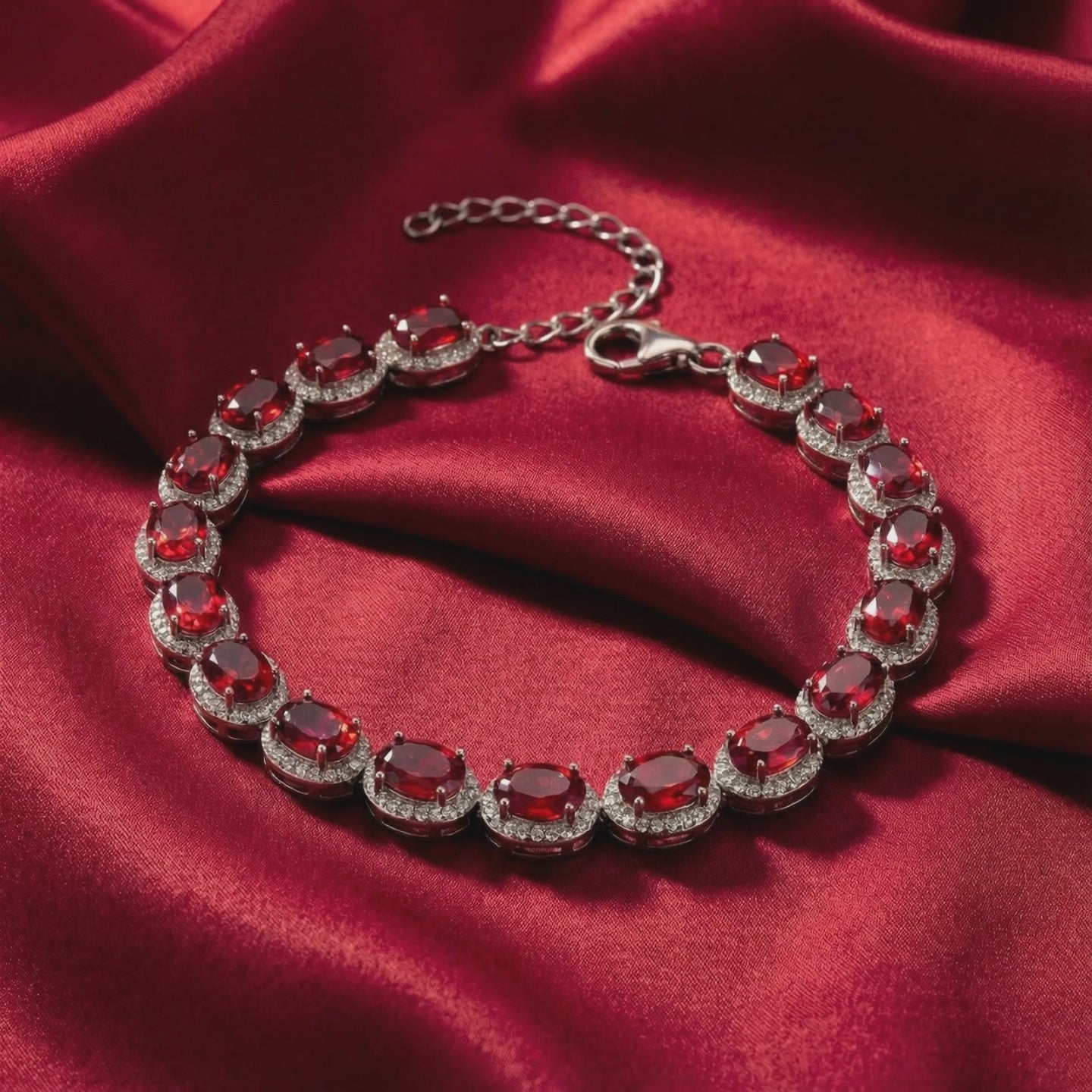 Solid gold tennis bracelet with simulated rubies.
