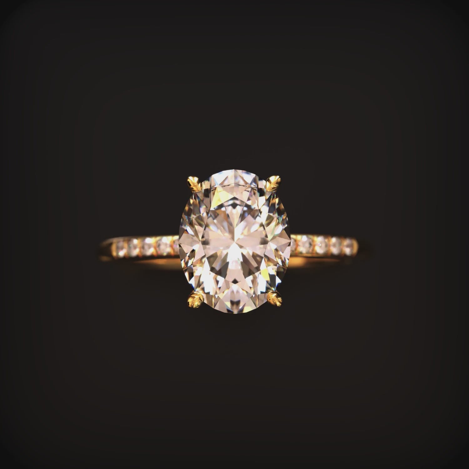 Video of an oval moissanite ring in solid gold.