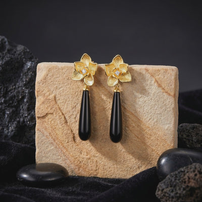 Calla floral black onyx drop earrings in solid gold.