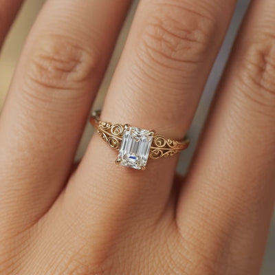 The Adelina Rae emerald-cut moissanite ring crafted in solid gold.