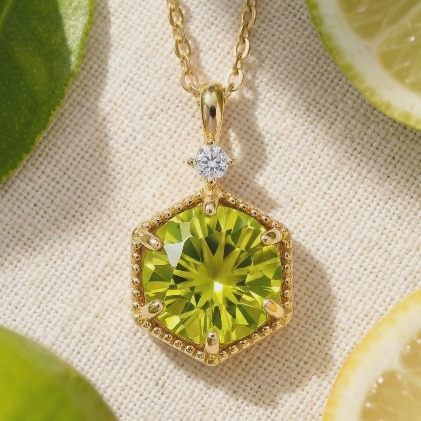 A video showcasing the solid gold necklace with a hexagonal simulated peridot pendant.