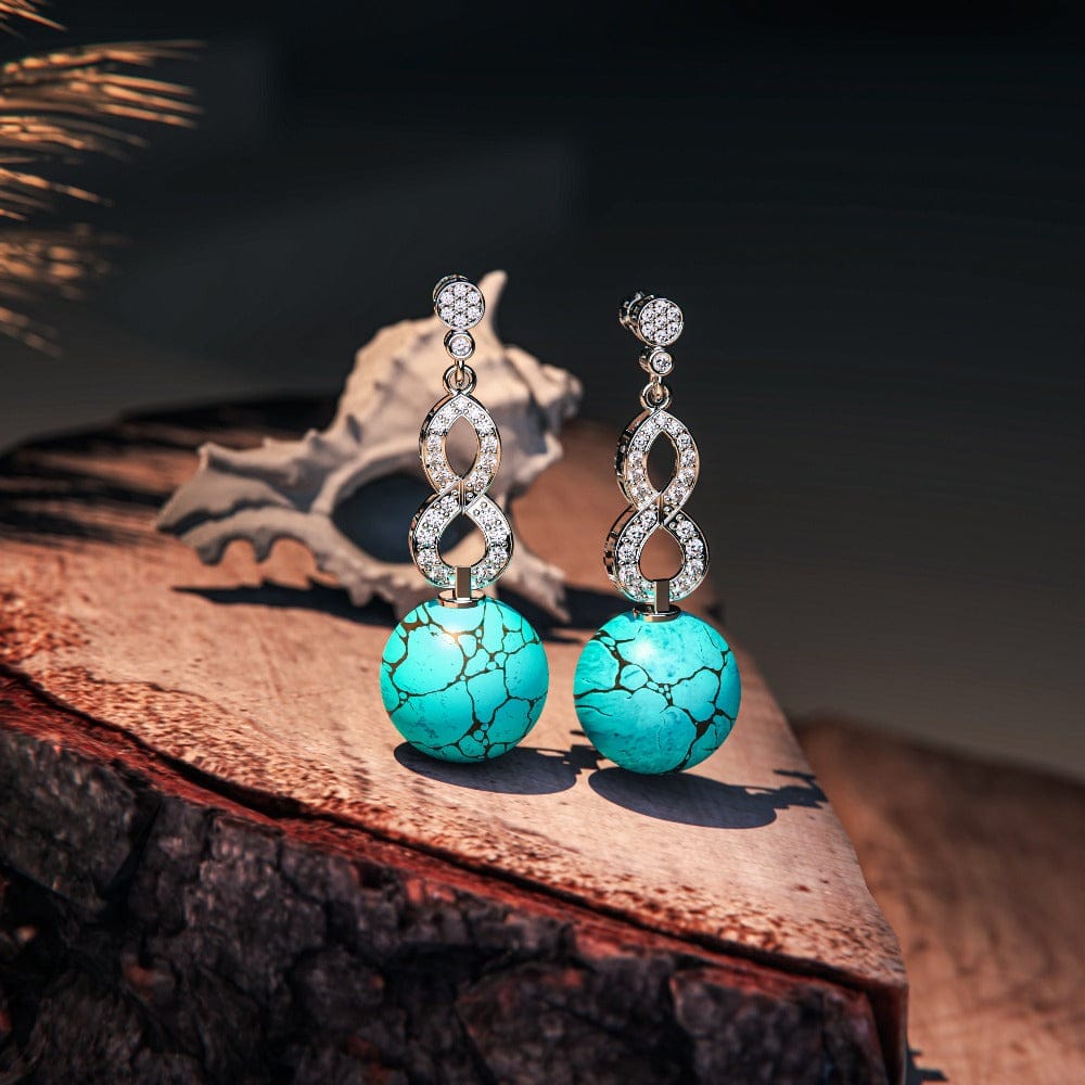 Azure Oceanic Earrings featuring turquoise stones in a sterling silver setting