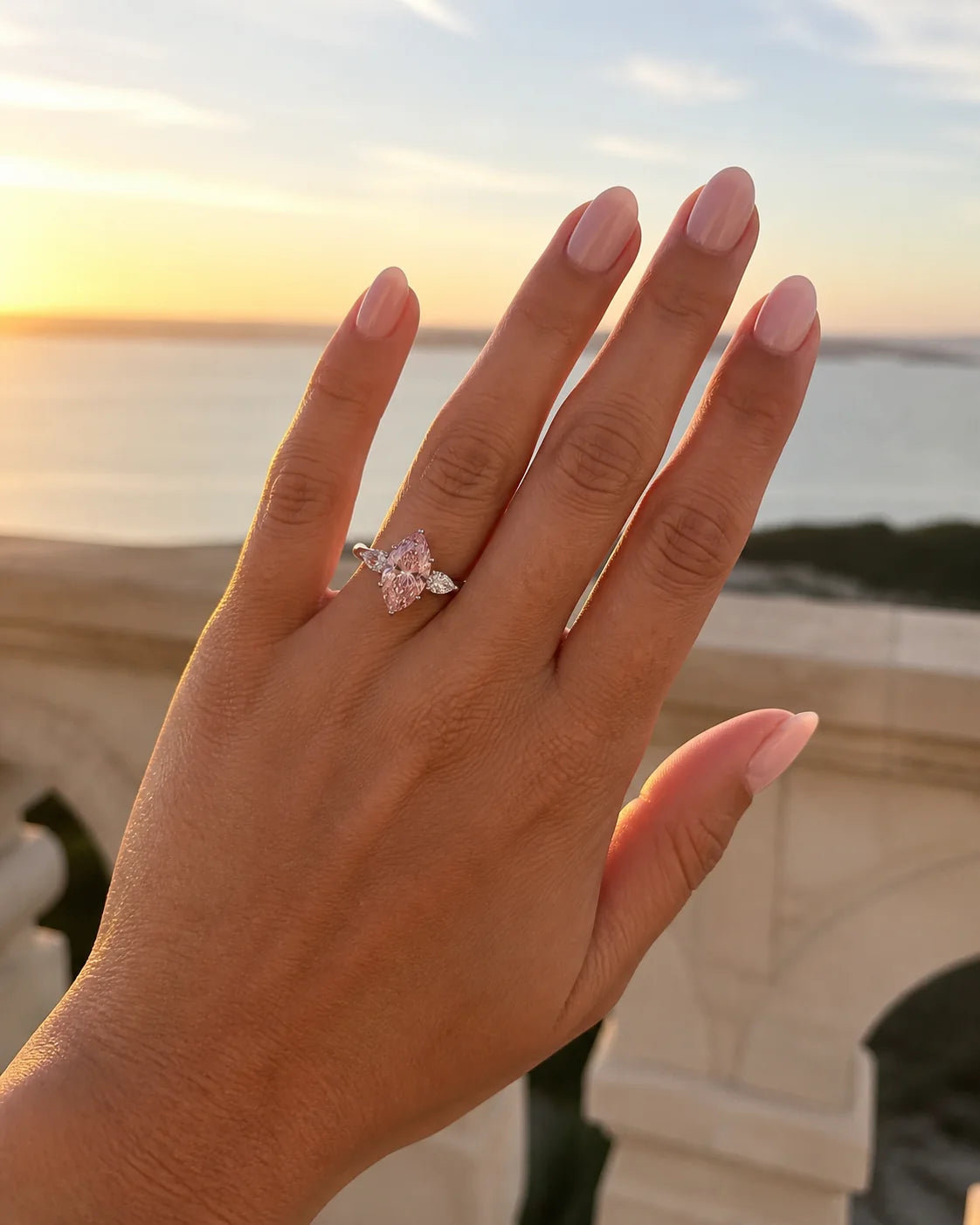 Pink marquise fine-jewelry ring photographed at sunset